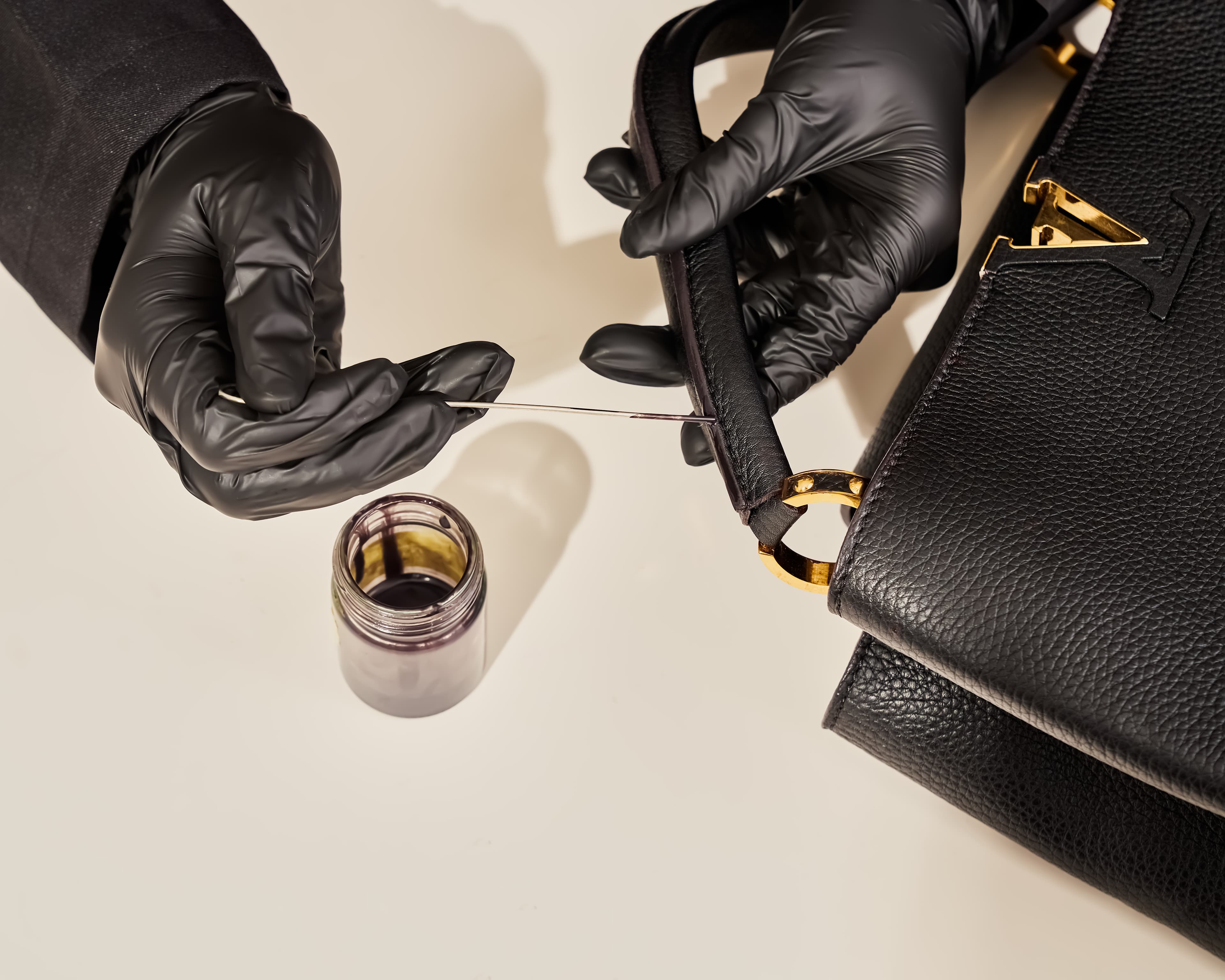 LV bag handle stitching detail
