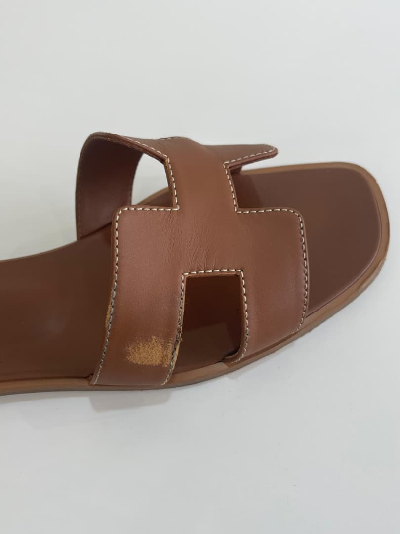Hermes Oran sandal before and after cleaning and restoration — before